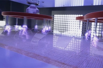 How to improve adhesion to helmet visors using corona treatment